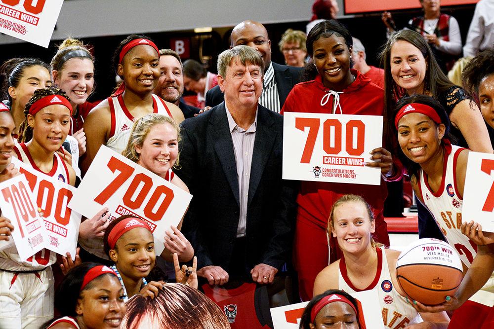 Coach Wes Moore celebrates his 700 career wins with the NC State women&#8217;s basketball team on Sunday, Nov. 10, 2019 at Reynolds Coliseum. The Wolfpack beat UNCW 80-40.