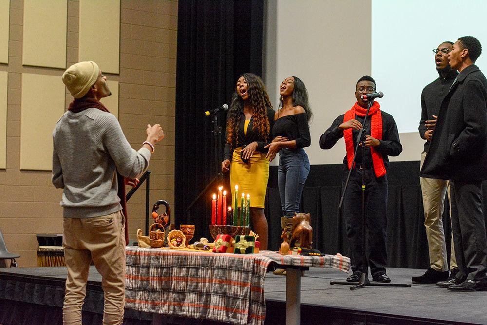 Members of Uninhibited Praise Gospel Choir sing "O Come All Ye Faithful" during the Kwanzaa celebration held in Witherspoon Student Cinema on Dec. 6, 2018.