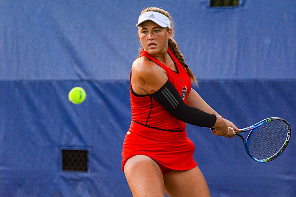 Sophomore Liz Norman returns a volley against Duke senior Kaitlyn McCarthy on Friday, May 10, 2019 at Ambler Tennis Stadium in Durham. Norman lost to McCarthy 6-3, 6-3 during the Wolfpack&#8217;s 4-0 overall loss to the Blue Devils.