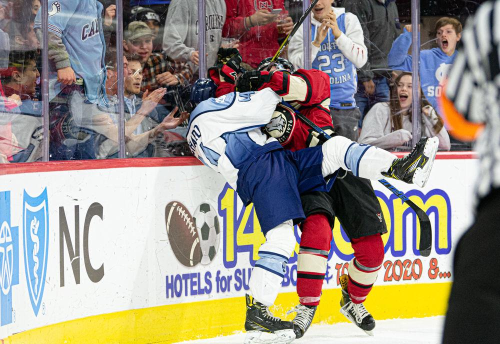UNC Ice Hockey defenseman Matt Richard scuffles with NC State Icepack forward Colbi Pederson on Monday, Jan. 20, 2020 at PNC Arena. Both players received double-minor penalties for roughing and the Icepack went on to win 9-3.