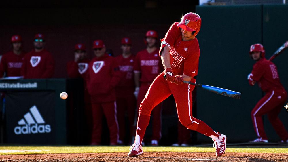 Junior outfielder Jonny Butler swings against James Madison on Friday, Feb. 14, 2020 at Doak Field. Butler went 1-4 with one home run and two runs batted in as the Wolfpack won the season-opener 4-0.