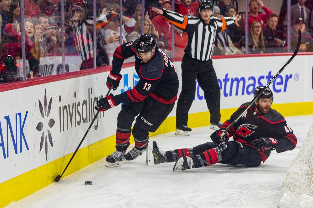 Hurricanes left wing Warren Foegele dribbles the puck around the goal versus the Avalanche on Friday, Feb. 28, 2020 at PNC Arena. Foegele had three shots in 20 shifts in the 3-2 loss to the Colorado Avalanche.