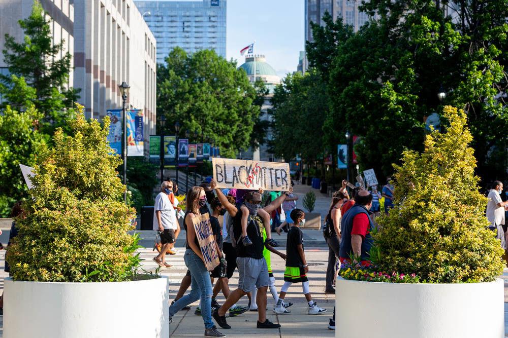 Protesters march through downtown Raleigh during a demonstration on Saturday, May 30, 2020. The protest was one among many around the United States in response to the death of George Floyd in Minneapolis.
