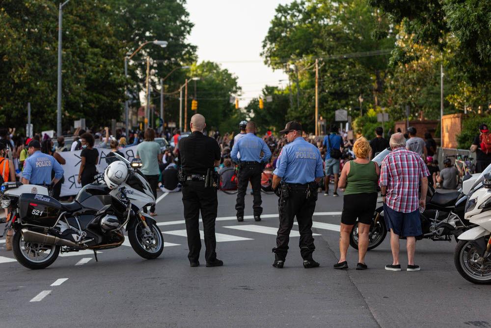 The Raleigh Police Department stand in silence along with the protesters as protesters mark eight minutes and 46 seconds of silence on Tuesday, June 2, 2020 in front of the governors mansion. Tuesday marked the second night of peaceful protesting that ended before the start of curfew at 8 P.M.