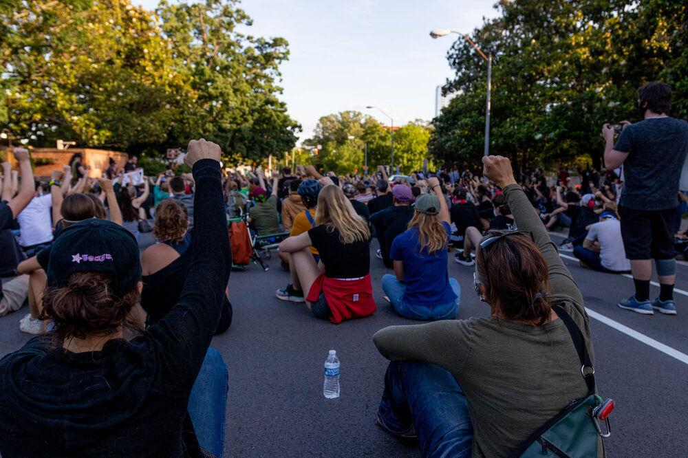 Protesters raise their arms up in solidarity with the Black Lives Matter movement on Monday, June 1, 2020 in downtown Raleigh. These protests were held in response to the death of George Floyd in Minneapolis. After a weekend of violent riots the mayor of Raleigh, Mary-Ann Baldwin issued a city wide curfew until further notice that starts at 8 P.M. and runs through 5 A.M. the next morning. Raleigh has also requested for the National Guard to be present around the city to help in keeping the peace. The protest on June 1 was completely peaceful through its entirety.