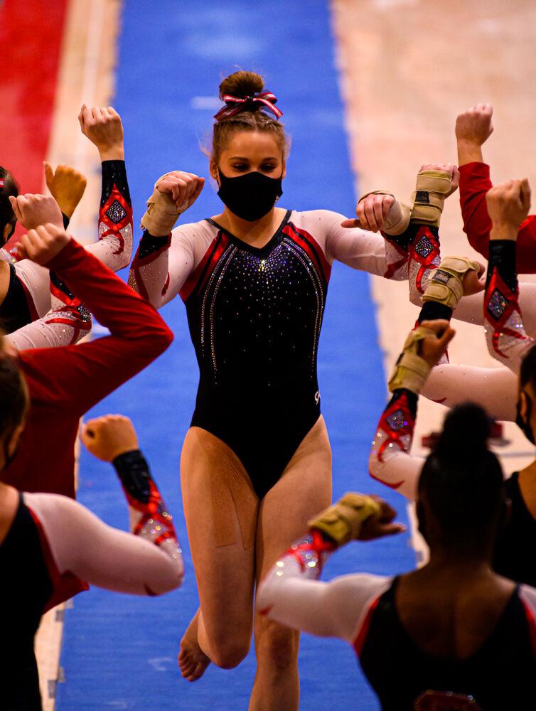 Senior Victoria Prati greets her teammates after performing on the vault on Saturday Feb. 27, 2021 at Reynolds Coliseum. The Wolfpack took first place in the tri-meet over North Carolina and Temple with a score of 196.200.