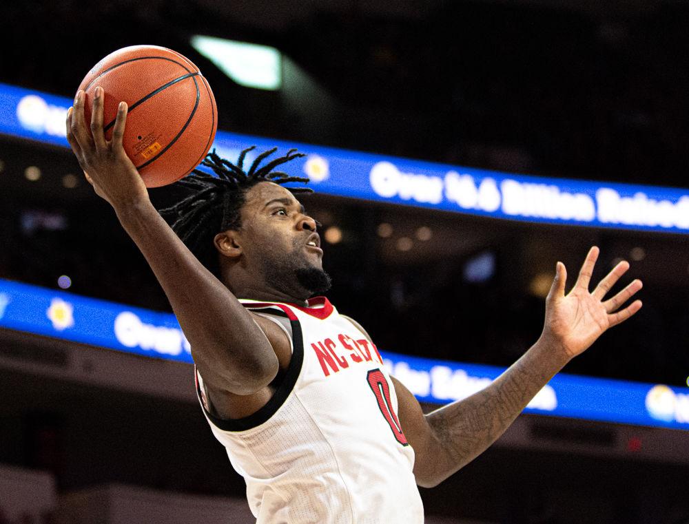 Redshirt junior forward D.J. Funderburk gets called for traveling while trying to save the ball from going out of bounds against Appalachian State on Sunday, Dec. 29, 2019 at PNC Arena. Funderburk recorded 22 points and nine rebounds as the Wolfpack won 72-60.