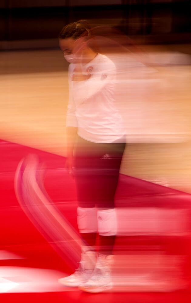 Senior opposite hitter Melissa Evans dribbles the ball before serving against Clemson on Friday, March 19, 2021 at Reynolds Coliseum. Evans recorded 15 kills as the Wolfpack won in straight sets.