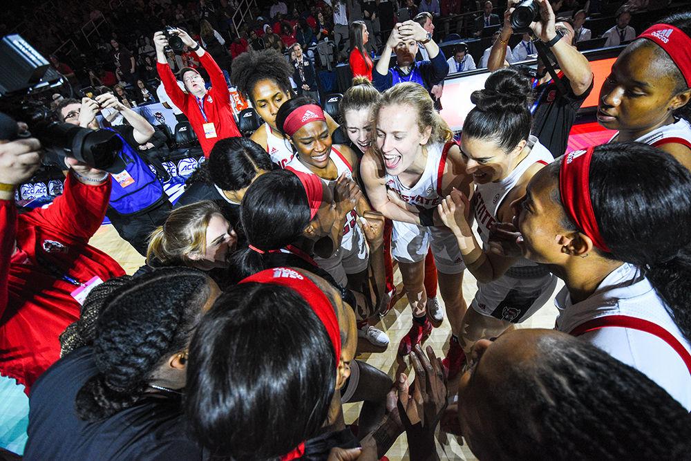 The NC State Women's basketball team huddles before the championship game of the 2020 ACC Women's Tournament versus the Florida State Seminoles on Sunday, March 8, 2020 in the Greensboro Coliseum. The Wolfpack beat the Seminoles 71-66 to win their first ACC title since 1991.