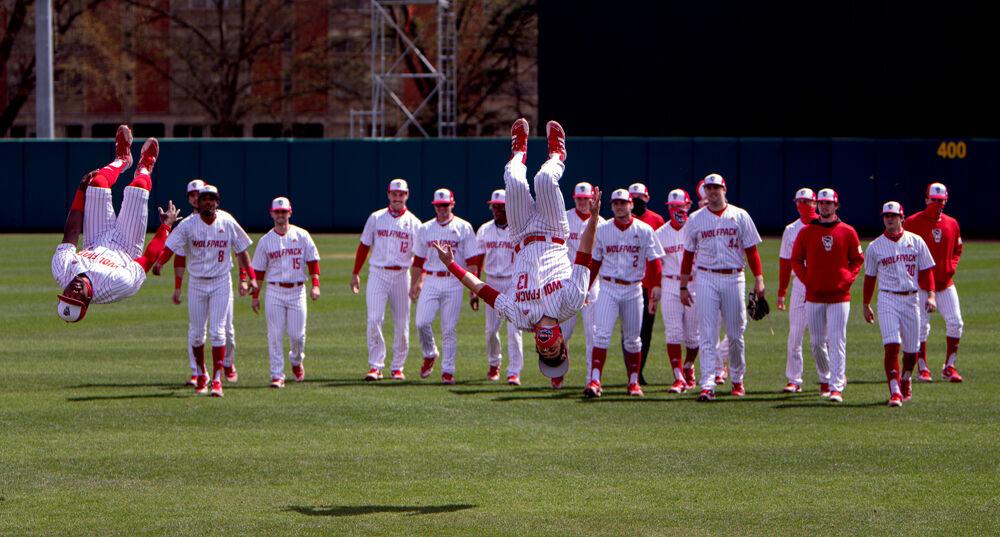 Junior outfielder Devonte Brown and sophomore infielder Tyler McDonough get excited to play Louisville on Saturday, March 20, 2021 at Doak Field. The Wolfpack lost 6-3.