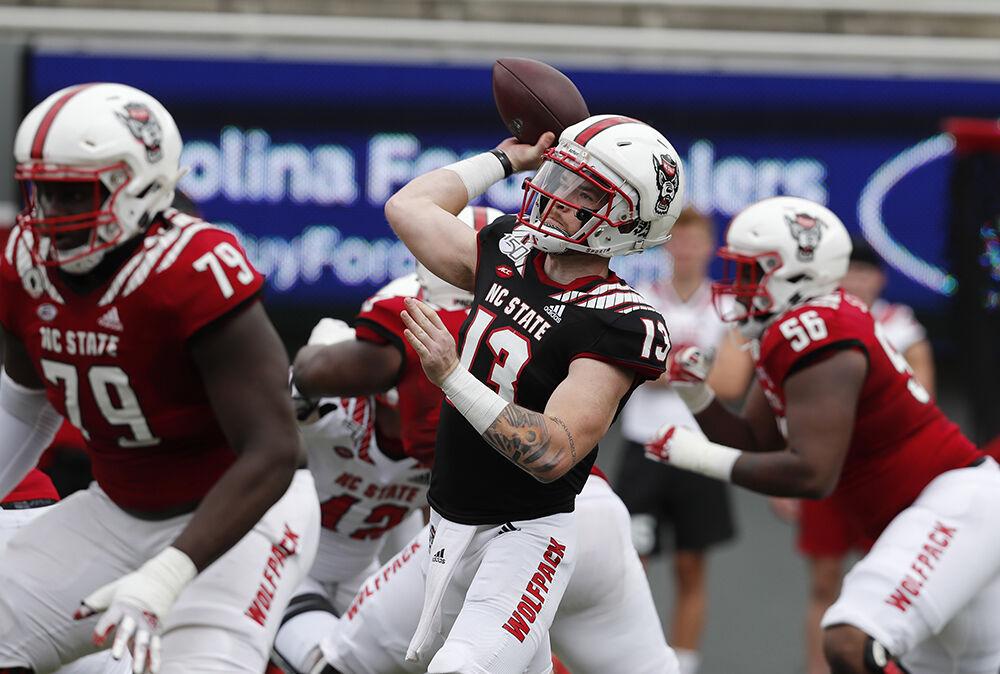 N.C. State quarterback Devin Leary (13) passes during the first half of N.C. State football&#8217;s spring game at Carter-Finley Stadium in Raleigh, N.C., Saturday, April 10, 2021.