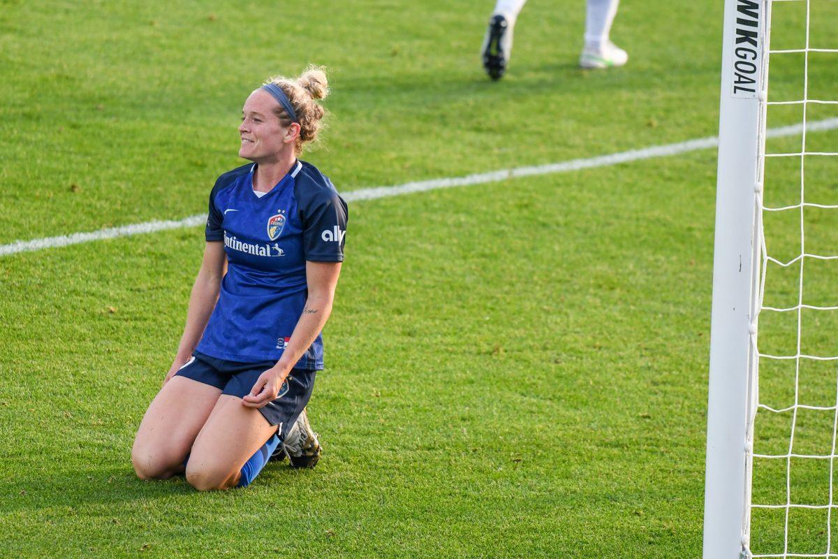 Forward Kristen Hamilton pauses on the ground after a missed goal attempt during the game versus the Orlando Pride on Saturday, May 22, 2021 in Sahlen's Stadium at WakeMed Soccer Park. The Pride beat the Courage 2-1.