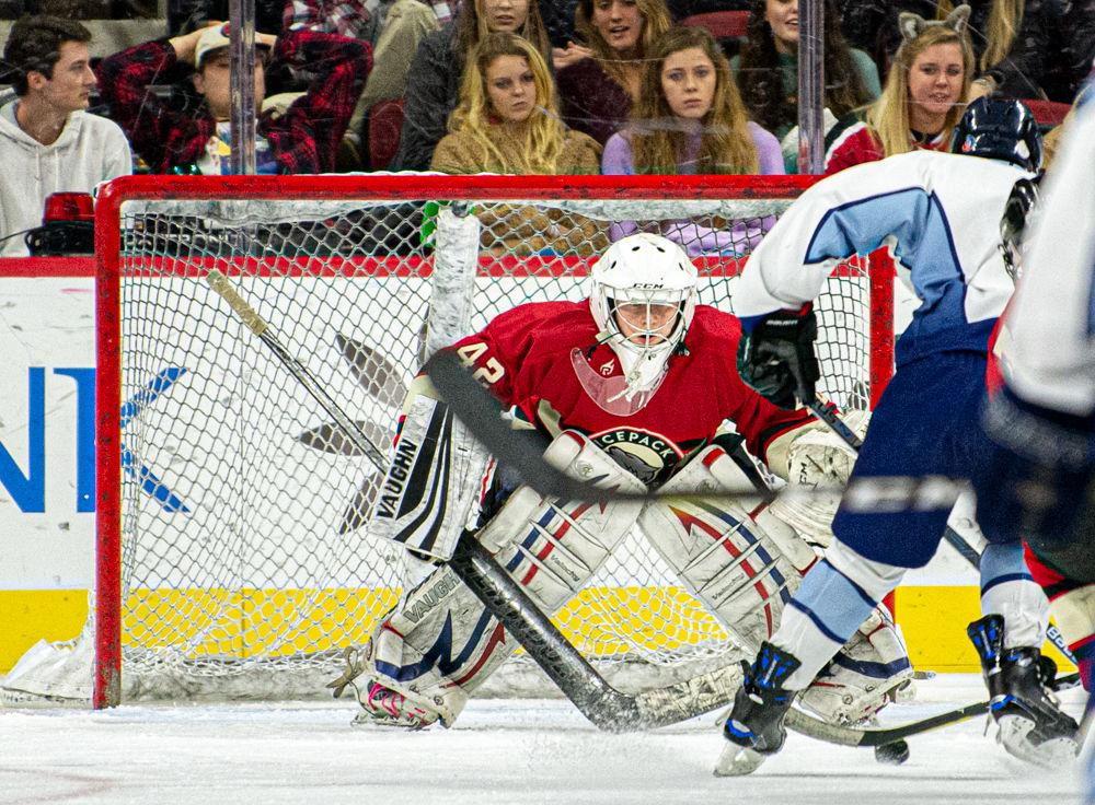 Josh Cannon, a fourth-year studying aerospace engineering, prepares to face a shot by UNC Ice Hockey on Monday, Jan. 20, 2020 at PNC Arena. The Icepack won 9-3.