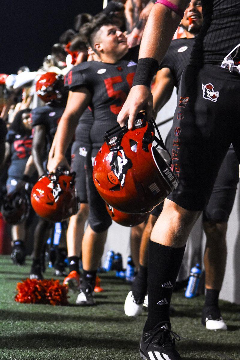 NC State players high five fans after the game at Carter-Finley Stadium on Thursday, Sept. 2, 2021. The Wolfpack shutout the USF Bulls 45-0.