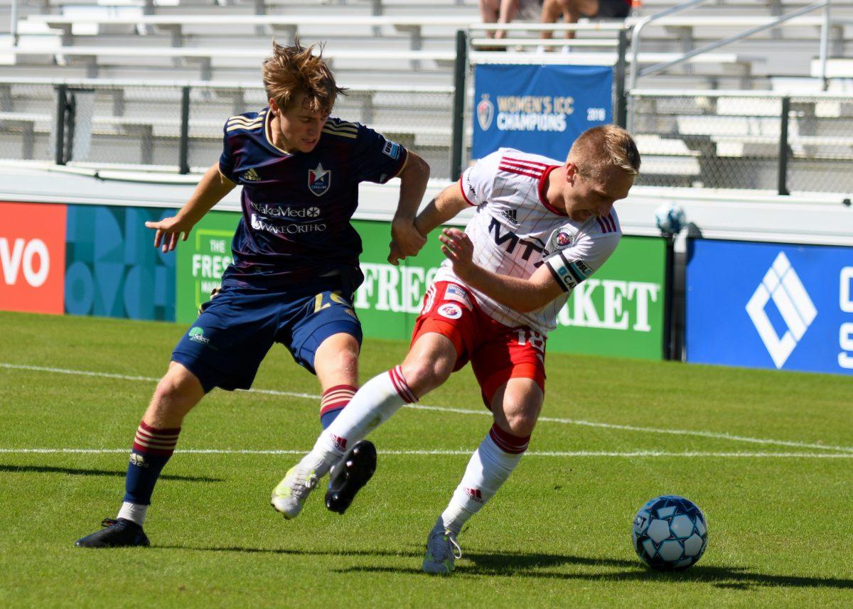 North Carolina FC forward Cole Frame loses possession of the ball during the game versus North Texas SC on Sunday, Sep. 26, 2021 in Sahlen's Stadium at WakeMed Soccer Park. NCFC lost to North Texas SC 1-0.
