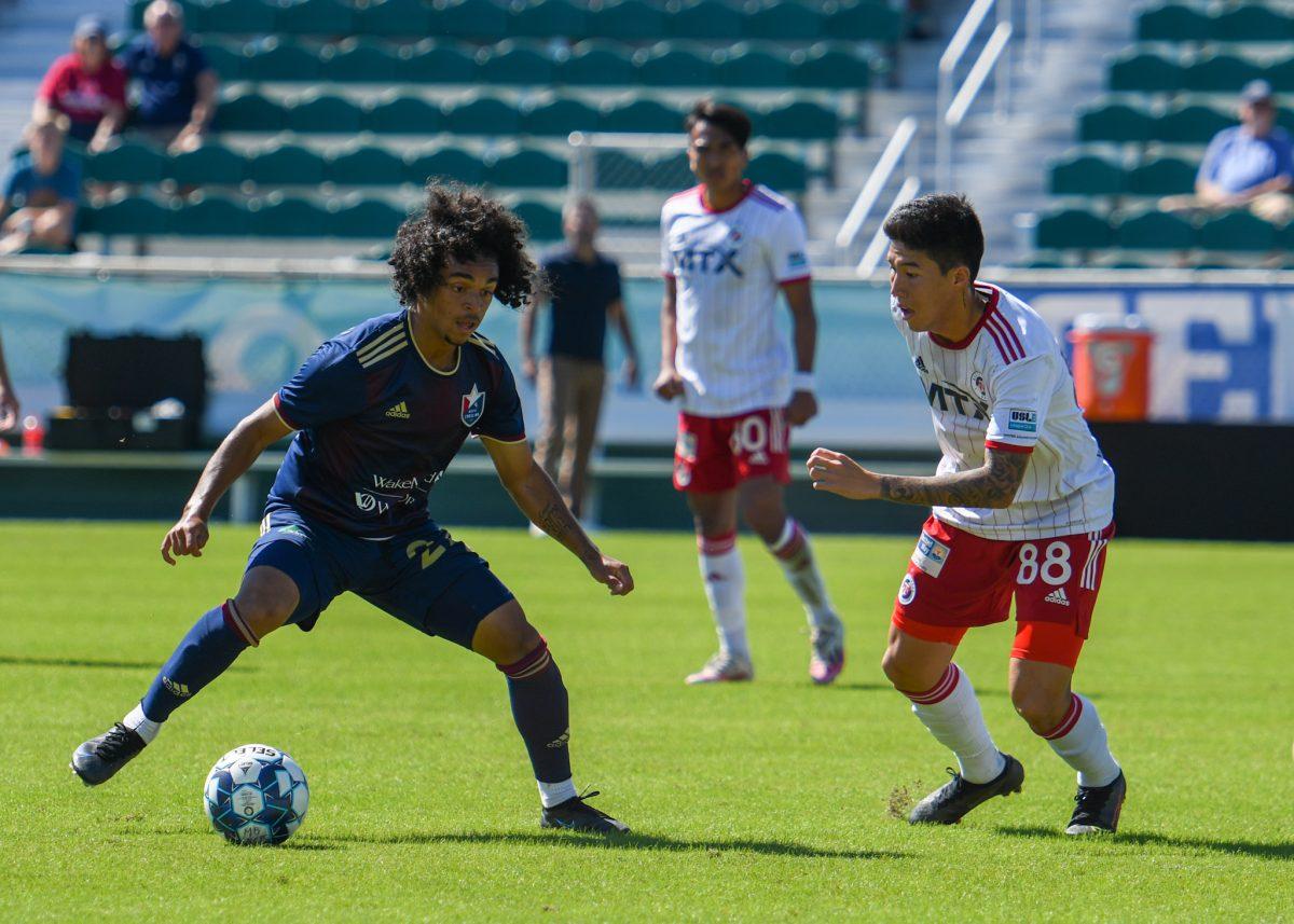 North Carolina FC forward Aziel Jackson tries to cut past the North Texas SC defense and get to the goal on Sunday, Sep. 26, 2021 in Sahlen's Stadium at WakeMed Soccer Park. NCFC lost to North Texas SC 1-0.