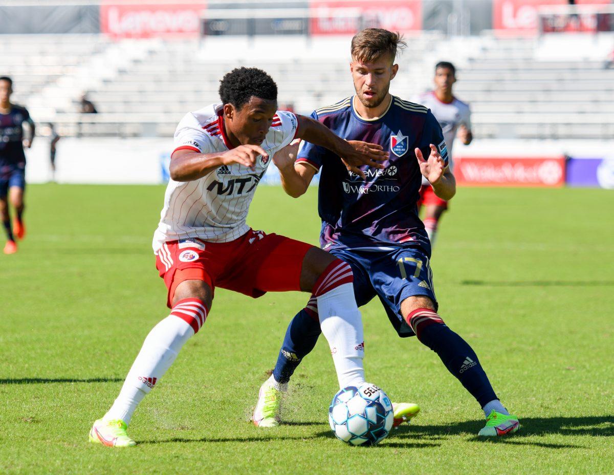 North Carolina FC forward Josh Coan applies pressure to the North Texas SC offense on Sunday, Sep. 26, 2021 in Sahlen's Stadium at WakeMed Soccer Park. NCFC lost to North Texas SC 1-0.
