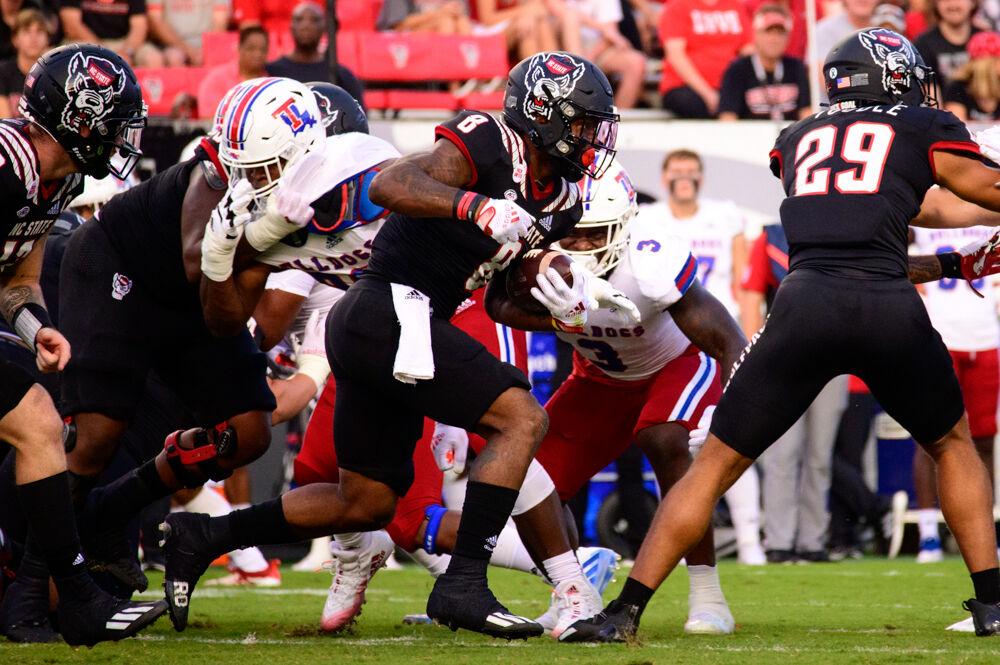 Junior running back Ricky Person Jr. carries the ball against Louisiana Tech on Saturday, Oct. 2, 2021 at Carter-Finley Stadium. Person had 15 carries for 90 yards and a touchdown as the Wolfpack won 34-27.