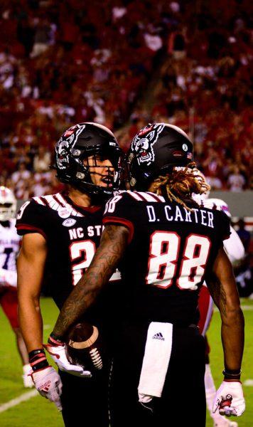 Redshirt sophomore wide receiver Devin Carter celebrates with his teammate during the game against Louisiana Tech on Saturday, Oct. 2, 2021 at Carter-Finley Stadium. The Wolfpack won 34-27.