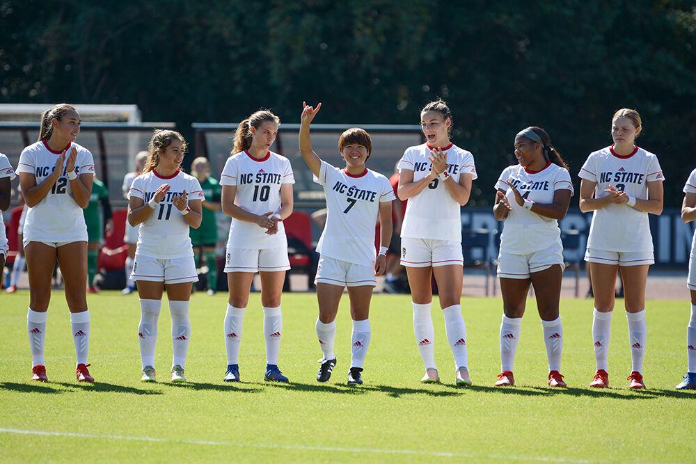 Freshman midfielder Emika Kawagishi smiles at the crowd before the game versus Syracuse on Sunday, Oct. 24, 2021 at Dail Soccer Field. Kawagishi scored the second goal in the game with an assist by sophomore forward Jameese Joseph. NC State won against Syracuse 3-0.