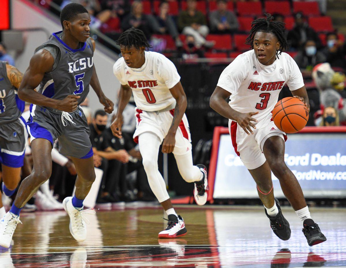 Sophomore guard Cam Hayes drives down the court during the game versus the Elizabeth City State Vikings on Monday, Nov. 1, 2021 in PNC Arena. Hayes scored 9 points and shot 100% at the free throw line against Elizabeth City State. The Wolfpack beat the Vikings 87-68.