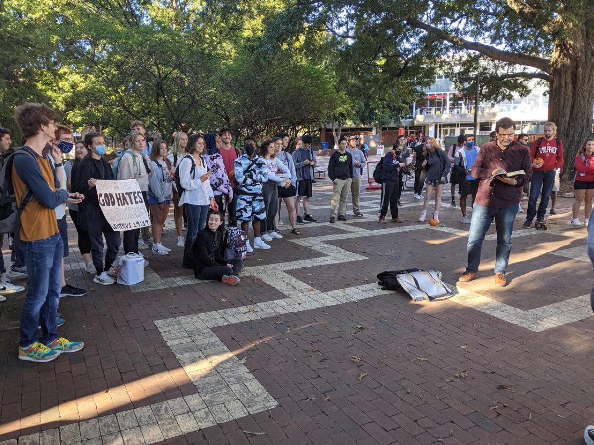 Students argue with travelling preacher Tom Short in the Brickyard.&#160;