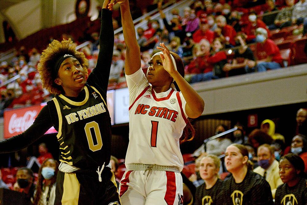 Sophomore guard Genesis Bryant takes a shot during NC State&#8217;s game against UNC Pembroke at Reynolds Coliseum on Wednesday, Nov. 3, 2021. Bryant put up 12 points during the game and Wolfpack beat the Braves 92-36.