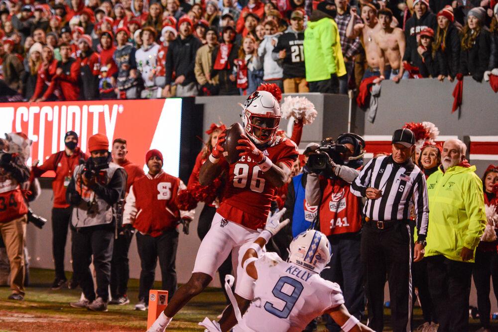 Senior wide receiver Emeka Emezie makes the go-ahead touchdown grab for the Wolfpack's last home game of the season against UNC-Chapel Hill at Carter-Finely Stadium on Friday, Nov. 26, 2021. The Wolfpack won 34-30.