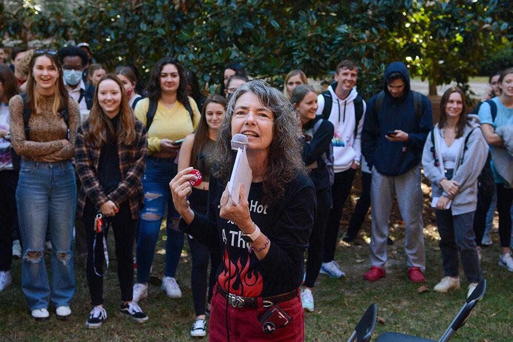 Campus preacher Cindy Smock, better known as "Sister Cindy," speaks to a crowd of NC State students during her visit outside Bostian Hall on Wednesday, Nov. 17, 2021. Smock has garnered over 300k&#160;followers across Tiktok and Instagram from her videos of her college visits.