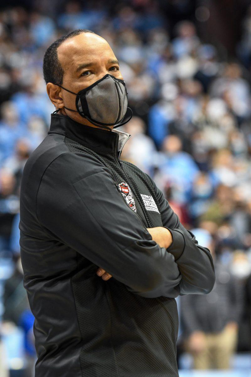 Head coach Kevin Keatts looks out to the crowd before the game versus UNC on Saturday, Jan. 29, 2022 in the Dean E. Smith Center. The Wolfpack lost to the Tar Heels 100-80.