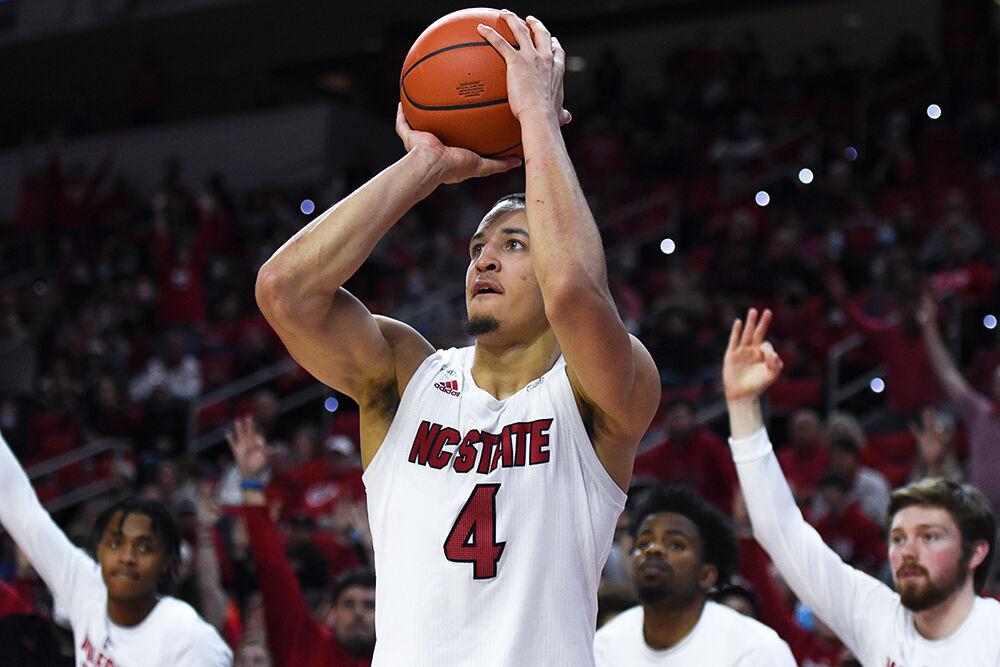 Senior forward Jericole Hellems goes to shoot a three-pointer in the game against the Virginia Tech Hokies on Wednesday, Jan. 19, 2022 in PNC Arena. Hellems scored 15 points and had four rebounds. NC State lost 62-59.