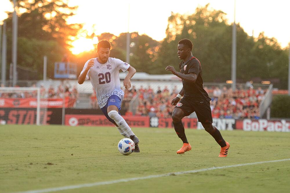Freshman forward Ivy Brisma attempts to go around the Presbyterian defense during the game on Friday, Aug. 31, 2018 at the Dail Soccer Stadium. The Wolfpack beat Presbyterian 2-0.