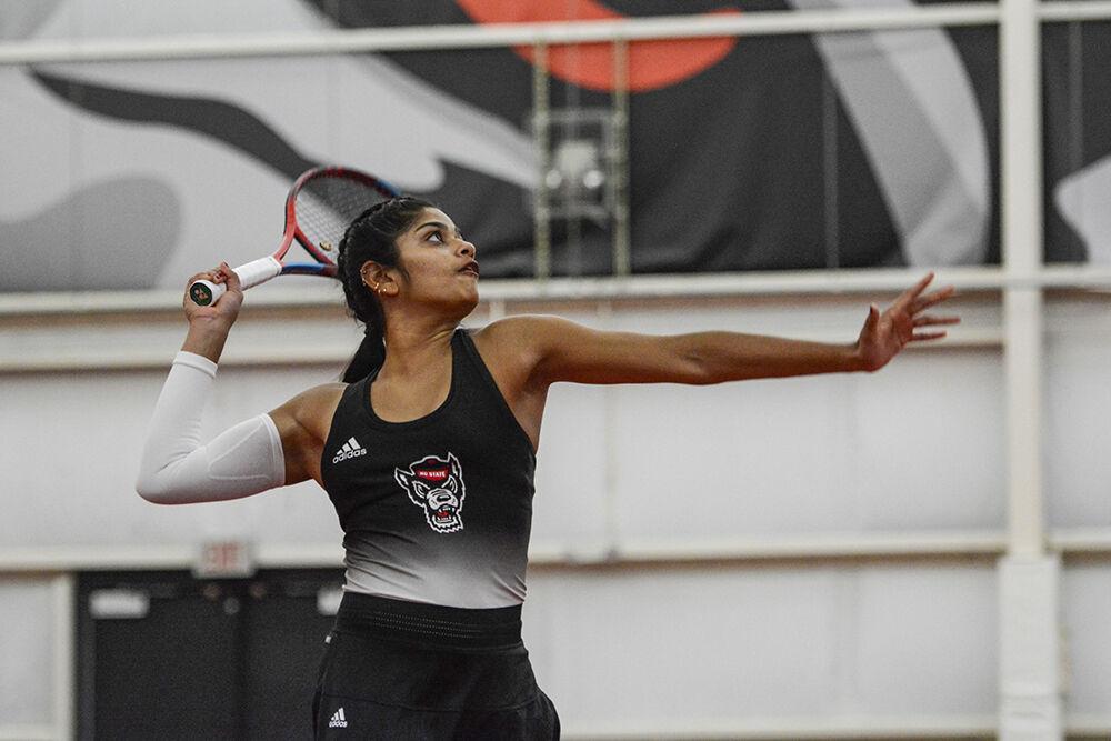 Senior Sara Nayar prepares to slam a high ball at the net during a home tennis match against Wake Forest at J.W. Isenhour Tennis Center on&#160;Sunday, Jan. 30, 2022. The Wolfpack beat the Demon Deacons 4-0.
