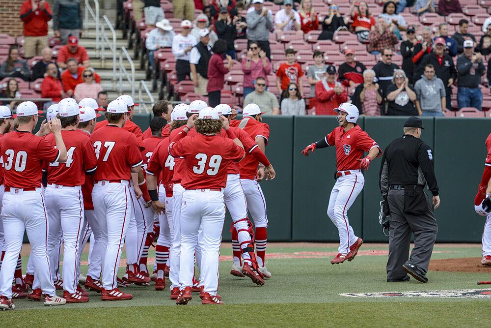 Senior second baseman J.T Jarrett celebrates his home run with the rest of the team during the game against High Point on Tuesday, Feb. 22, 2022 in Doak Field at Dail Park. Jarrett was 3 for 4 during the game. The Wolfpack beat the Panthers 18-3.