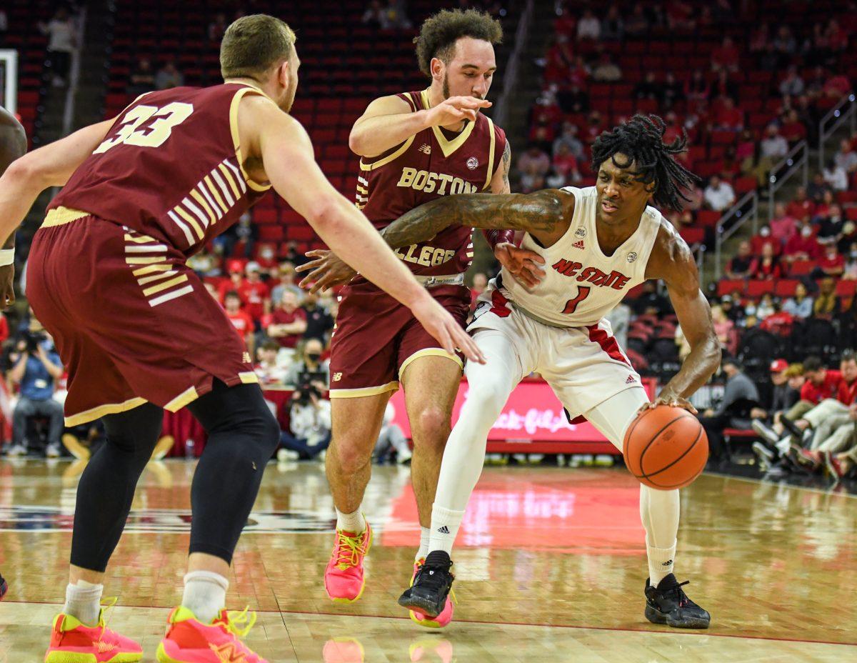 Redshirt sophomore Dereon Seabron gets double-teamed by the Boston College Eagles on Wednesday, Feb. 23, 2022 in PNC Arena. Seabron scored 20 points and had three rebounds against Boston College. The Wolfpack lost to the Eagles 69-61.