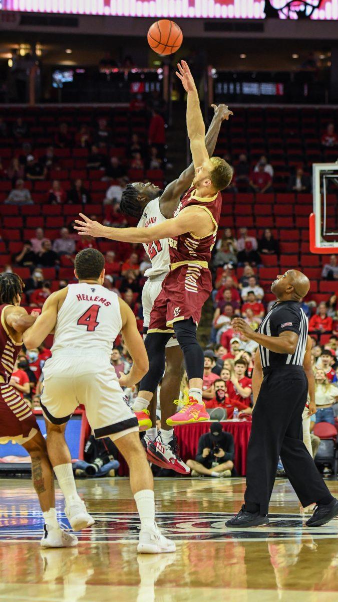 Sophomore forward Ebenezer Dowuona goes up for the tip-off during the game versus the Boston College Eagles on Wednesday, Feb. 23, 2022 in PNC Arena. Dowuona scored four points and had seven rebounds against Boston College. The Wolfpack lost to Boston College 69-61.