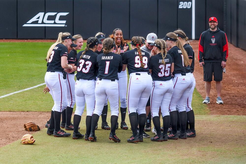 The Wolfpack huddles up before the game against Lehigh on Friday, Feb. 18, 2022 at Dail Softball Stadium. NC State was able to pull a win over Lehigh with a final score of 3-0.