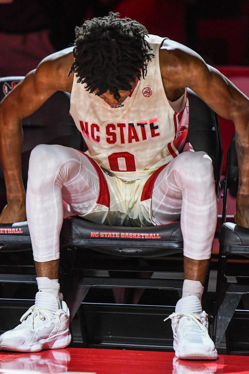 Freshman guard Terquavion Smith waits for his name to be called in the starting lineups before the game versus the Syracuse Orange on Wednesday, Feb. 2, 2022 in PNC Arena. Smith led NC State with 25 points against Syracuse. The Wolfpack lost to the Orange 89-82.