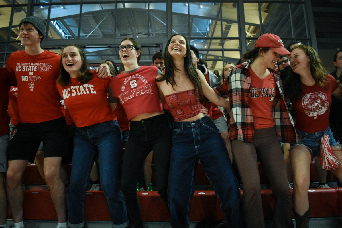 The NC State student section swag surfs before the start of the second half of the first round game of the NCAA Tournament versus the Longwood Lancers on Saturday, March 19, 2022 in Reynolds Coliseum. The Wolfpack beat the Lancers 96-68.