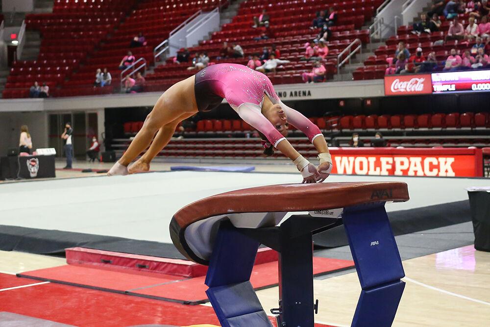 Sophomore gymnast Gabrielle Diaz mounts the vaulting table during the Pink Meet against Temple in Reynolds Coliseum on Friday, Feb. 25, 2022. Diaz scored a career-best of 9.875 on vault. NC State lost 196.675-196.600.
