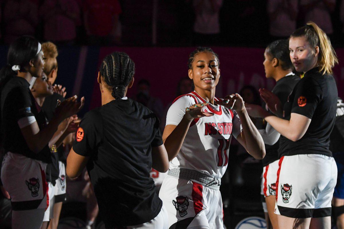Junior wing Jakia Brown-Turner does a pregame dance with freshman guard Aziaha James before the ACC championship game against the University of Miami on Sunday, March 6, 2022 inside Greensboro Coliseum. The Wolfpack won the championship game versus Miami with a score of 60-47.