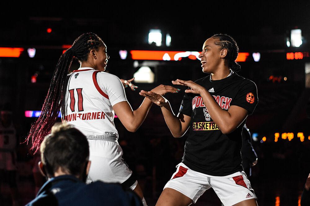 Junior wing Jakia Brown-Turner dances with freshman guard Aziaha James during team introductions during the quarterfinals of the Women's ACC Tournament on Friday, March 4, 2022 in the Greensboro Coliseum. Brown-Turner scored 15 points and had six rebounds against Florida State. The Wolfpack beat the Seminoles 84-54.