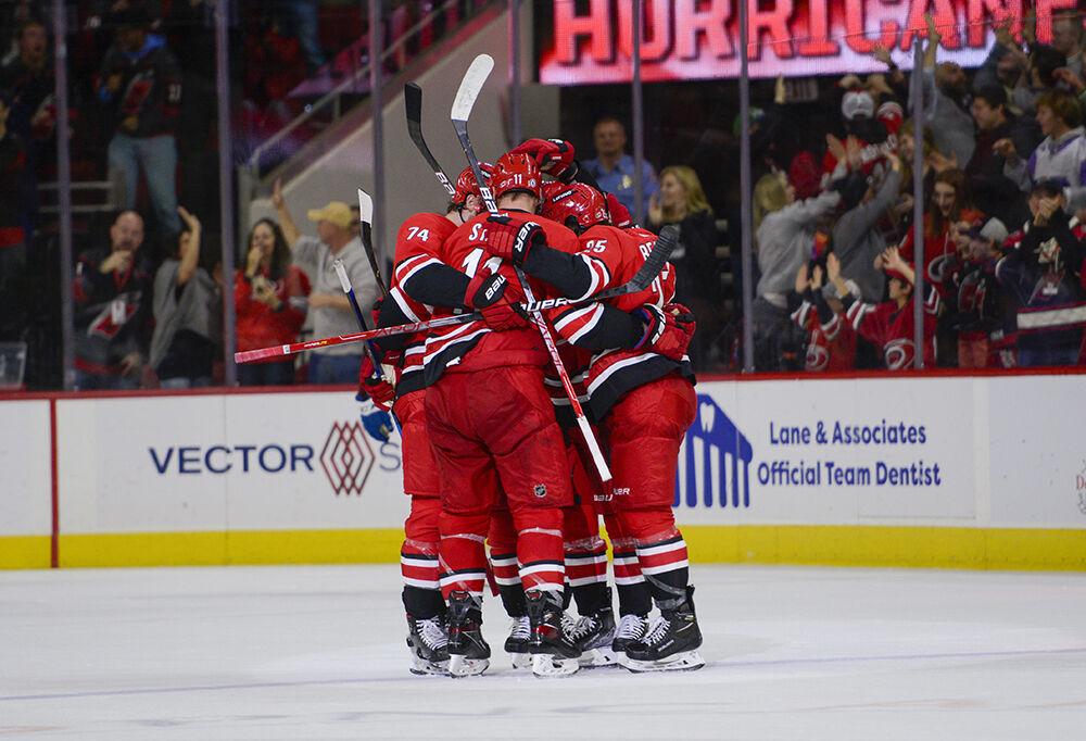 The Carolina Hurricanes celebrate a tie breaking goal scored by defenseman Ethan Bear during the game against the Colorado Avalanche on Thursday, March 10, 2022 in PNC Arena. The Hurricanes now only trail the Avalanche in the league standings by two points. The Hurricanes beat the Avalanche 2-0.