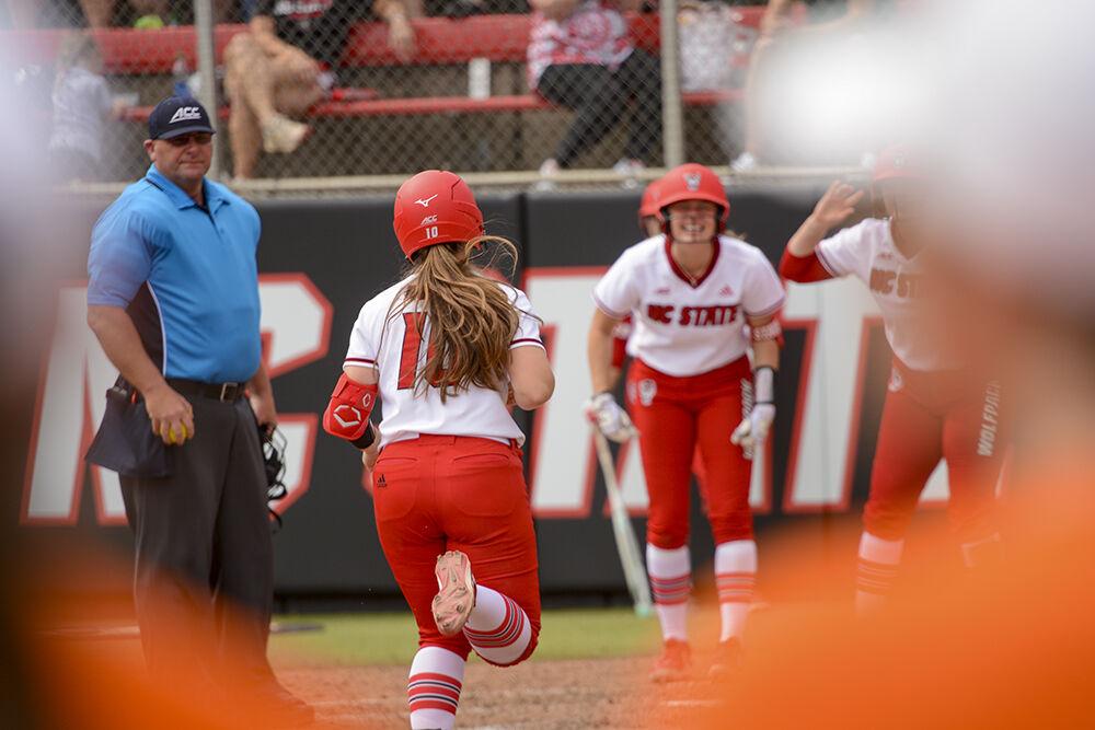 Fifth-year infielder Logan Morris returns to home base after hitting a homerun during the game against Syracuse on Sunday, March 6, 2022 in Dail Softball Stadium. NC State beat Syracuse 5-4 and won the series.