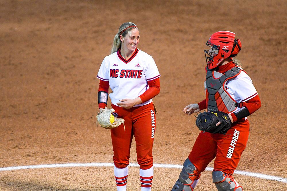 Graduate pitcher Maddie McPherson speaks with fifth year catcher Sam Sack during the game against Delaware on Saturday, Feb. 26, 2022 at Dail Softball Stadium. The Wolfpack lost the game 12-4.