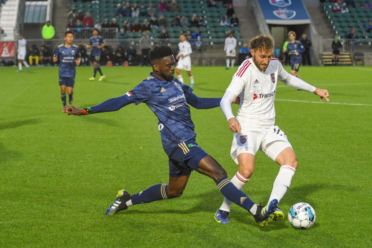 NCFC midfielder Raheem Somersall attempts to gain control of the ball during the game against the Chattanooga Red Wolves on Saturday, April 9, 2022 in Sahlen's Stadium at WakeMed Soccer Park. Somersall made 17 passes throughout the game. NCFC lost the game 3-1.