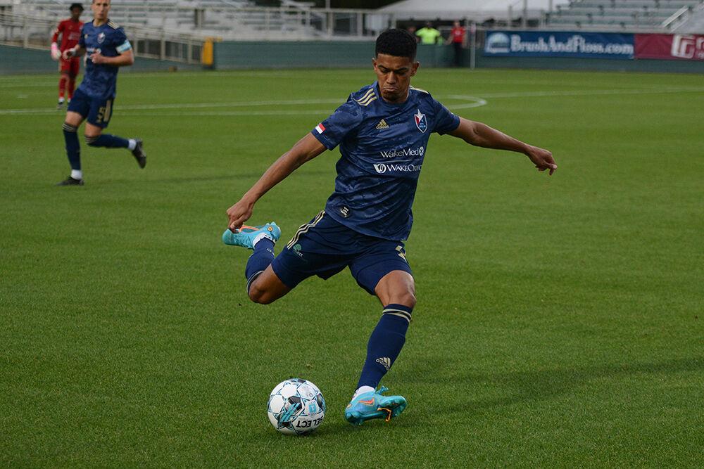 Defender Christian Lue Young clears the ball up field during NCFC's home soccer match against the Greenville Triumph at WakeMed Soccer Park on Saturday, April 16, 2022. NCFC tied the Triumph 1-1.