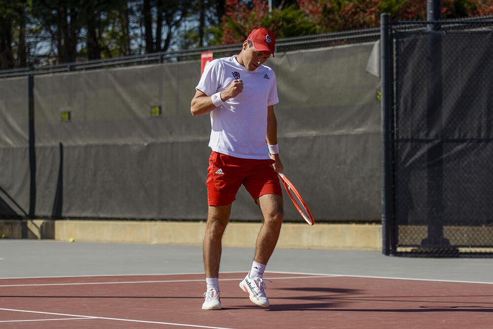NC State sophomore Luca Staeheli celebrates a point during the tennis match against Northwestern on Monday, March 21, 2022 in J.W Isenhour Tennis Center. The Wolfpack beat the Wildcats 4-2.