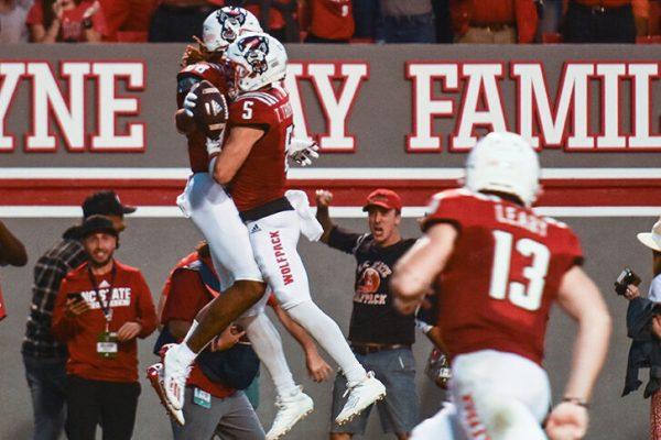Redshirt junior wide receiver Thayer Thomas celebrates with redshirt sophomore wide receiver Devin Carter after Carter scored a touchdown in the game against Clemson in Carter-Finley Stadium on Saturday, Sept. 25, 2021. Carter had five receptions and two touchdowns. The Wolfpack beat the Tigers 27-21 in double overtime.