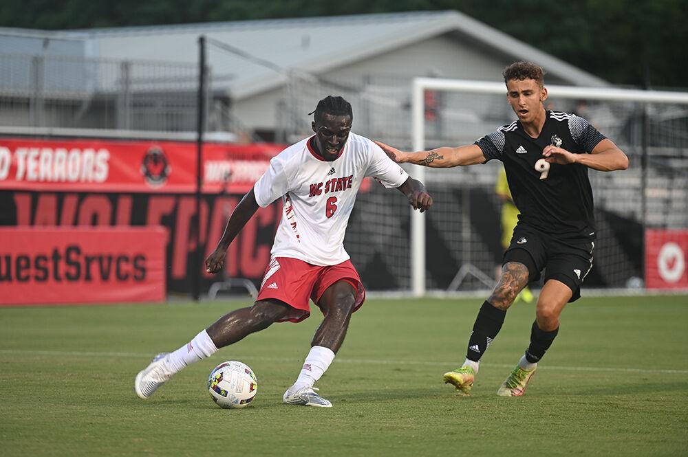 Senior defender Kendall Edwards prepares to pass the ball during the match against the Wofford Terriers on Monday, Aug. 29, 2022 at Dail Soccer Field. The Wolfpack won 4-0.